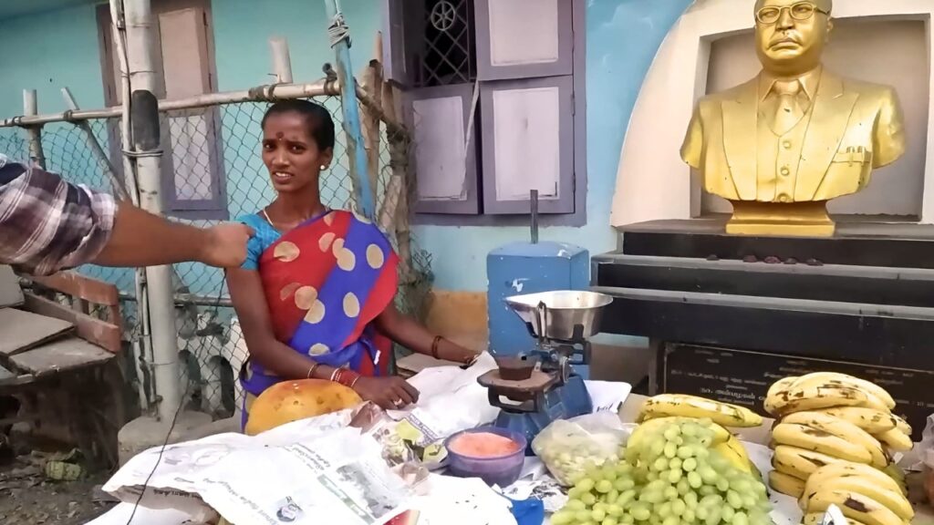 Interview with a vegetable vendor during Makkalin Kural by I-PAC, showcasing creative strategy.
